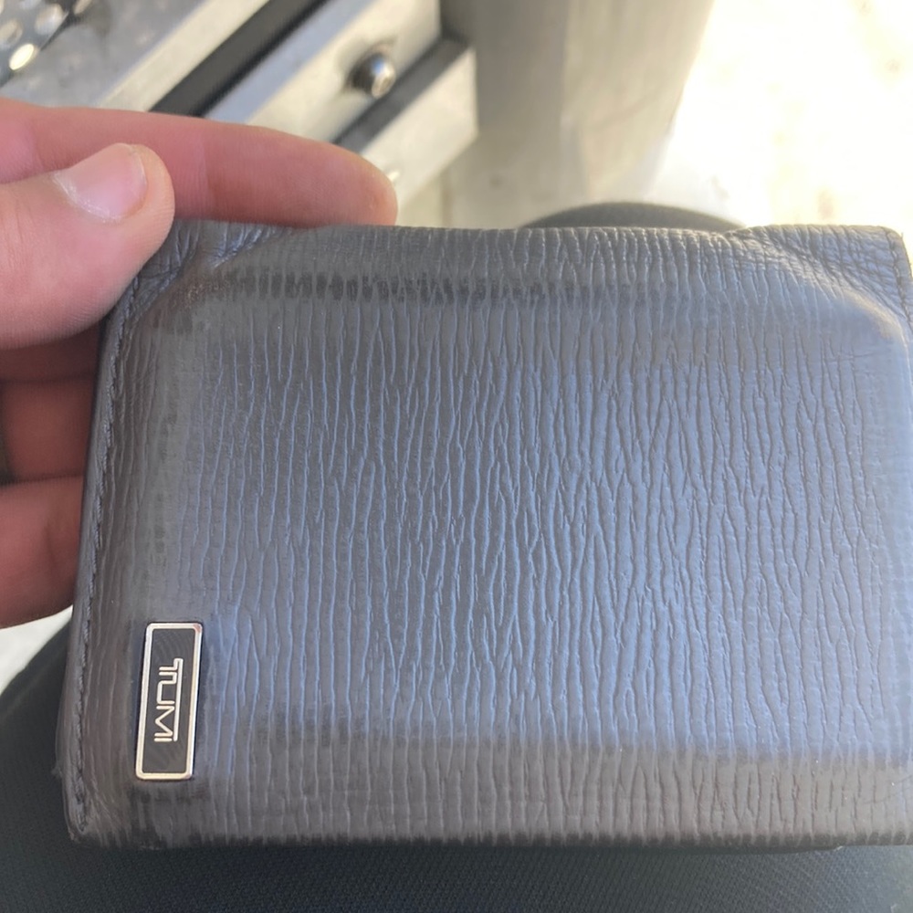 Grey tumi wallet
